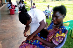 Focus on What You Can Do- This is one of our nursing staff giving a child an immunization to keep the child healthy. 